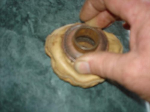 Hull seal leather compressed  Spring is possibly from a fuel pump.jpg