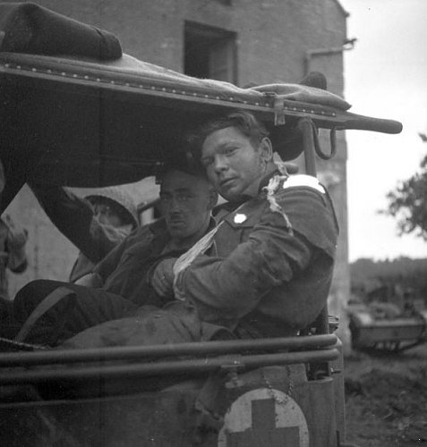 Wounded Le Regiment de la Chaudiere,Carpiquet,France,4 July 1944.jpg