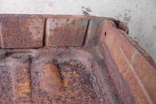 1 Rusted floor pan and seat riser (RR).jpg
