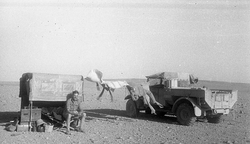 WW2 British Army Soldier with Truck-Lorry Palestine.jpg